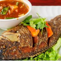 Pla Rad Prig (Whole Fish) · Deep fried whole tilapia topped with red bell pepper, onions, chilli paste, and crispy basil...