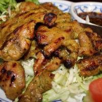 Moo Yang · Thai style curry marinated BBQ pork serve with house chili lime sauce