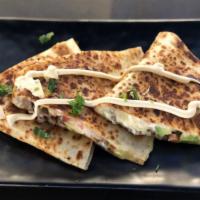 Quesadilla · Includes Cheese, Pico de Gallo choice of meat or vegetables grilled a la plancha