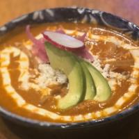 Chicken Tortilla Soup · Mexican tortilla soup with chicken, queso fresco, crema, and avocado topped with corn tortil...