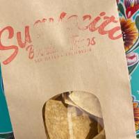 Bag of Handcut Tortilla Chips  · Tossed with sea salt. 

vegan, gf, df

our chips share a fryer with other gluten & dairy ite...