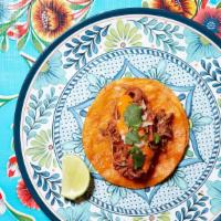 Beef Birria Taco · Prime beef short rib braised in mild red chile broth. Topped with onions, cilantro, & Suavec...