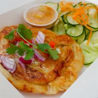 Murtabak · Thai-style stuffed pancake with ground chicken, curry spice, cucumber salad