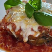 Polenta Parmigiana · layers of lightly fried polenta, tomato garlic pomodoro, mozzarella, basil