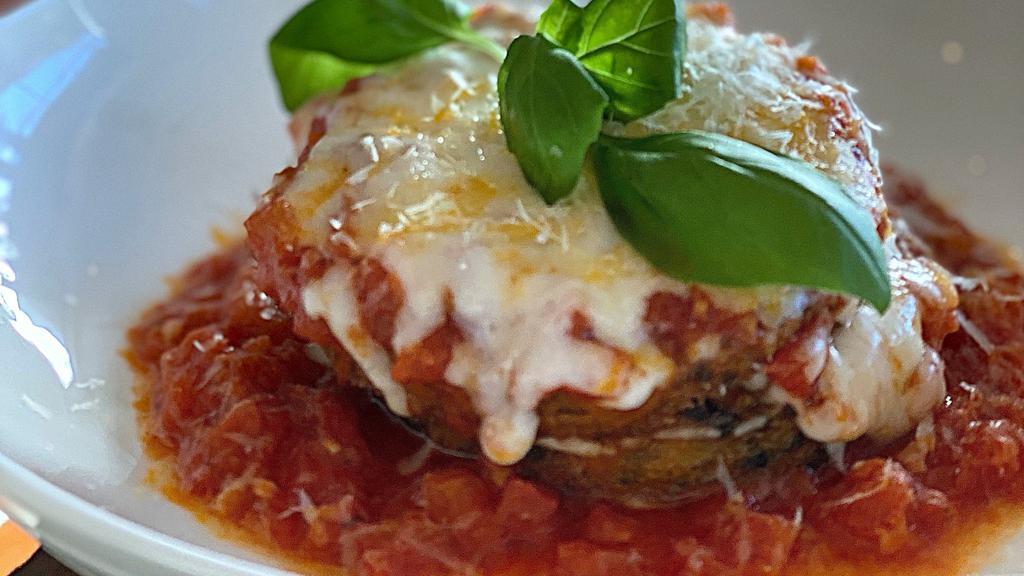 Polenta Parmigiana · layers of lightly fried polenta, tomato garlic pomodoro, mozzarella, basil