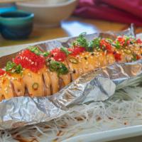 R14-lion King Roll · Inside: spicy salmon, cucumber outside: grilled salmon, spicy mayo masago, and green o