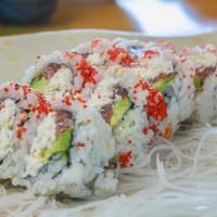 R4-Philly Roll · Inside: salmon avocado, cream cheese. outside: masago, sesame seed.