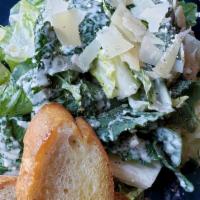 Kale Caesar Salad · Petite romaine hearts, garlic croutons, Parmesan cheese, house-made, caesar dressing.