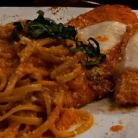 Seafood Linguine · Pasta tossed with prawns, salmon, calamari, diced tomato, basil and spicy marinara.