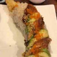 Jimbo · shrimp tempura, eel, avo, cucumber, crab meat, masago w/ eel sauce