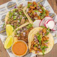 1. Street Taco · Corn Tortilla, Choice of Meat, Onion & Cilantro, Radish, Limes, and Salsa.
