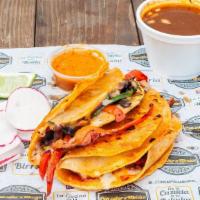 Veggie Taco / Birria Style · A corn tortilla, cheese, bell pepper, mushrooms, onions and cilantro,  radish, limes and salsa