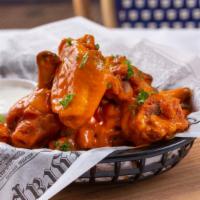 Buffalo Chicken Wings · Deep-fried crispy chicken wings tossed in our spicy buffalo sauce.