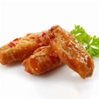 Cajun Sweet n' Sour Chicken Wings · Deep-fried crispy chicken wings tossed in our delicious and tangy Cajun spiced Sweet n' Sour...