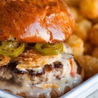 Hot Wes. · The burger that started it all: Onion Rings, Queso, Pickled Jalapenos