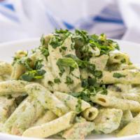 Chicken  Pesto Penne · Grilled chicken and fresh spinach cooked in a pesto Alfredo base with spaghetti.