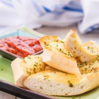 Garlic Toast · Toasted bread garnished with garlic and butter. Served with marinara sauce.