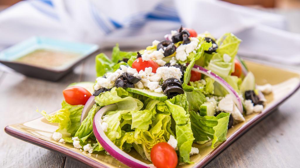Greek Salad · Romaine lettuce with  cucumbers, red onions, kalamata olives, cherry tomatoes, feta cheese and italian dressing.