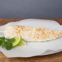 ELOTE CON QUESO · Fresh corn-on-the-cob brushed with lime crema, dusted with cotija cheese, & cayenne pepper