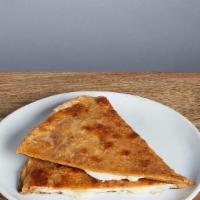 POCO QUESO · Just melted jack cheese folded in a crispy flour tortilla