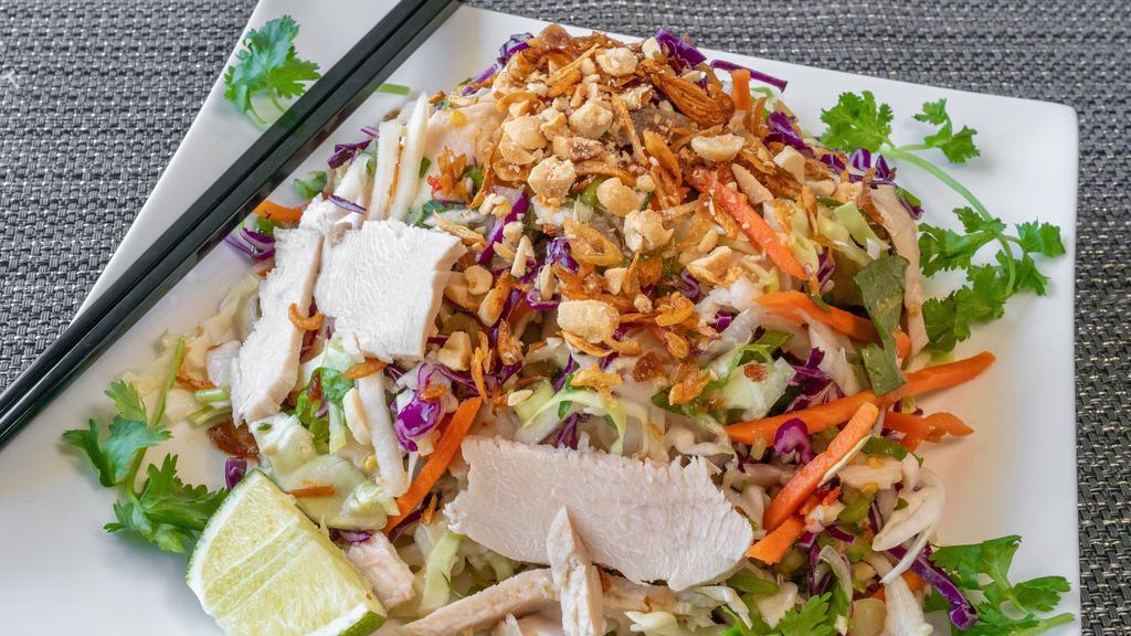 Vietnamese Chicken Salad · Mixed with shredded cabbage, mint leaves, pickled veggies, fried shallots and peanuts.