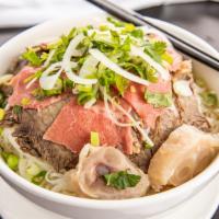 Combination Noodle Soup · Rice noodles with rare sliced eye round steak, well-done briskets and flanks, tendon and mea...