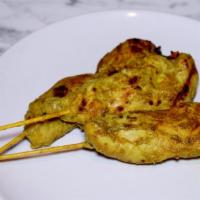 Gai Satay (Chicken) (5) · Grilled chicken on skewers marinated with Thai spices. Served with peanut sauce and cucumber...