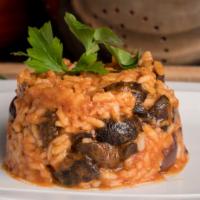 Risotto Boscaiola  · Italian Carnaroli rice sautéed with lightly spicy tomato sauce with mushrooms and olives. To...