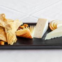 Artisan Cheese Plate  · red hawk & sottocenere al tartufo cheese
lime roasted nuts, sourdough baguette, seasonal fruit