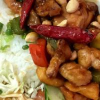Kung Pao Chicken Over Rice · Comes with Egg Roll and side salad.