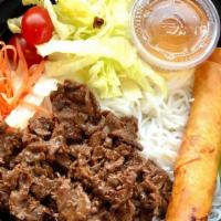 Grilled Beef Vermicelli BOWL · Comes with Egg Roll and side salad.