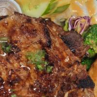 Grilled Porkchop Vermicelli · Comes with Egg Roll and side salad.