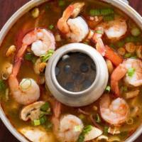 Tom Yum · Hot sour soup with fresh mushrooms, tomatoes, onions, lemongrass, kaffir lime leaves, cilant...