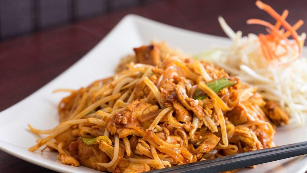 Pad Thai · Pan-fried thin rice noodles with egg, tofu, bean sprouts, and ground peanut in a delicately flavored sauce.