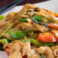 Drunken Noodles (Pad Kee Mao) · Spicy pan-fried flat rice noodles with tomatoes, onions, basil leaves, bell peppers and chili.