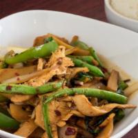 Basil · Sauteed meat with Thai basil, bamboo, onion, garlic, bell pepper, and fresh chili. Served wi...