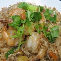 Pineapple Fried Rice · Thai-style fried rice deliciously prepared with shrimp, chicken, egg, yellow onion, carrots,...