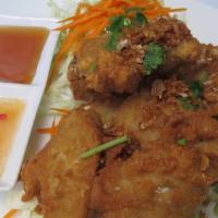 Chicken Wings · Deep-fried chicken wings marinated with Thai spices and breaded with wheat flour serve with ...