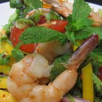 Mango Salad · Fresh mangoes cook with prawns and seasoned with thai spices sauce, red onion, green onion, ...
