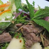 10. Yum Nua · Barbecued beef, mint leaves, red onion, cucumber, green onions, cilantro, ginger, and rice p...