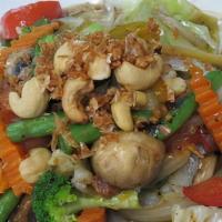 31. Pat Puk · For vegetarians. Mixed vegetables with bean curd and cashew nuts served with black bean sauce.