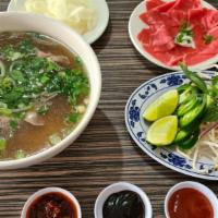 6. Rare Eye Round Steak / Phở Tái · Not Fully Cooked Rare Steak

(with onion and cilantro)

Comes with Bean Sprouts, Lemon and T...