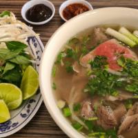 8.  Rare Eye Round Steak & Well Done Lean Flank/Phở Tái Nạm · (with onion and cilantro)

Comes with Bean Sprouts, Lemon and Thai Basil
Housin Sauce and Si...