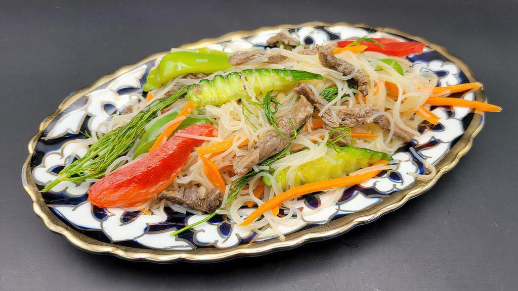 Funchoza (cold rice noodle salad) · Rice noodle, fresh cucumbers, bell peppers, marinated carrots, halal beef.
