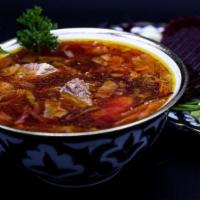 Borscht Soup · Sour soup packed with beetroot, beef , carrot, cabbage, onion, herbs, and spices.