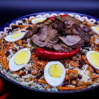 Sofi Osh (Palov) · Plov. Lamb and beef, carrots, onions, rice, raisins, chickpeas, garlic, and spices (cumin, a...