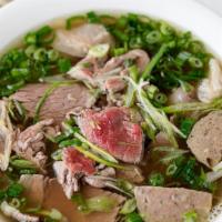 Phở Đặc Biệt  ⭐️ · Special Combination Pho with Rare  Filet Mignon, Flank, Fat Brisket, Tendon, Meat Balls Rice...