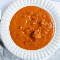 Butter Chicken · Boneless chunks of chicken cooked with cashews, Butter tomato base creamy sauce