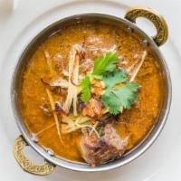 Beef Nihari  · A Delhi’s famous beef shanks cooked overnight in
Aromatics spices and herbs