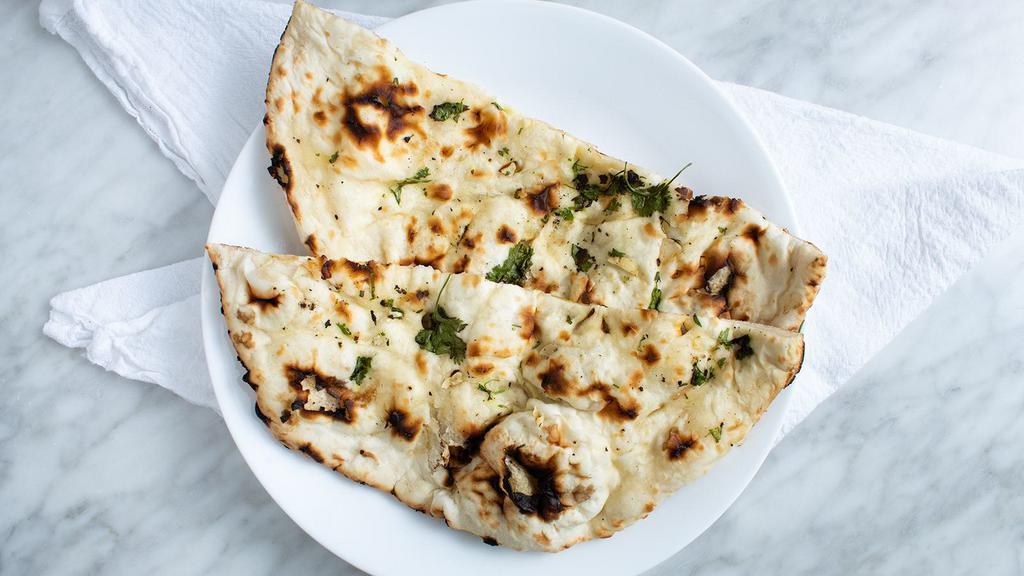 Garlic Naan · Naan topped with garlic and cilantro.
